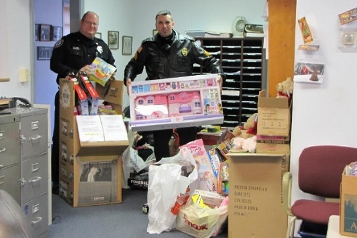 Officers with donated toys