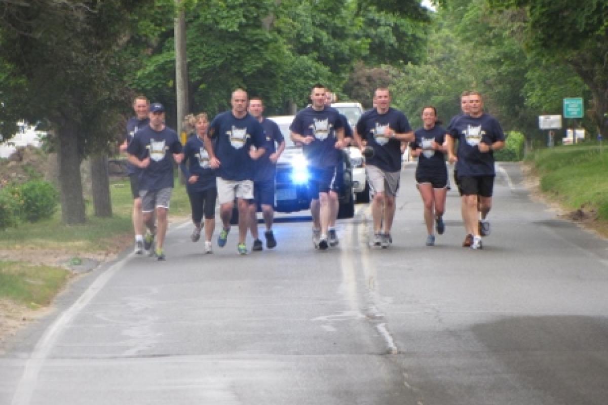 Officers running with police escort 3